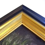 Wide frame in tones of grey and black then gold with gold beaded slip
